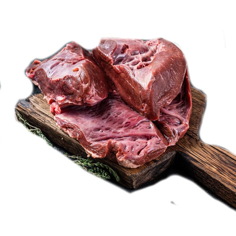 Raw cutted Beef or veal heart on a butcher board. Black background. Top View.
